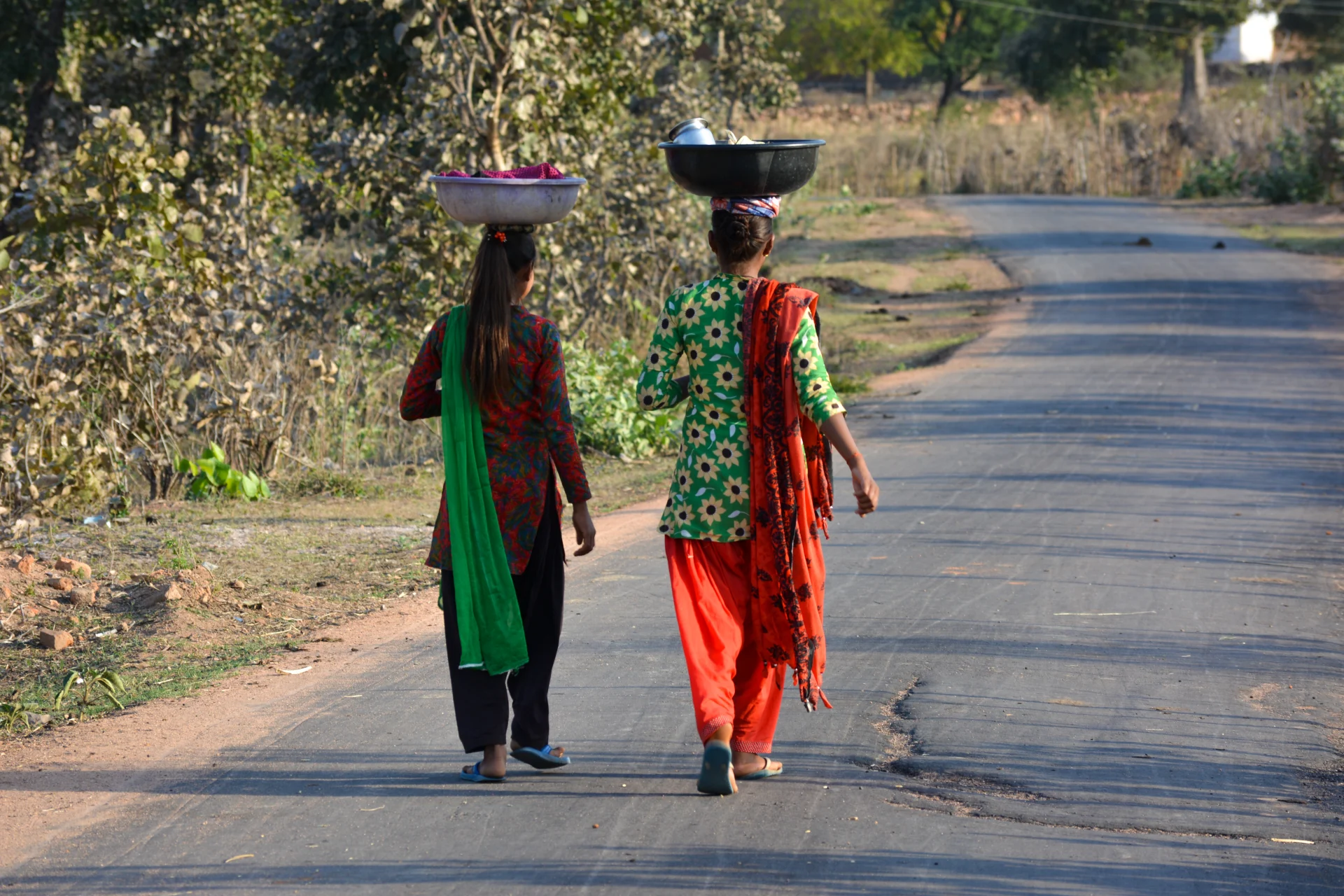 India - women walking on street in madhya pradesh